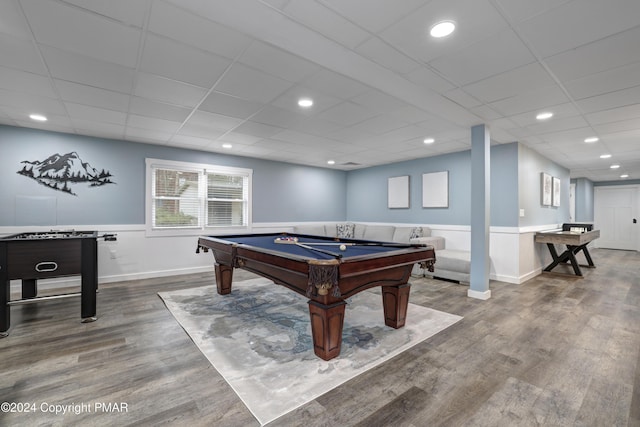 playroom with a wainscoted wall, wood finished floors, a paneled ceiling, and recessed lighting