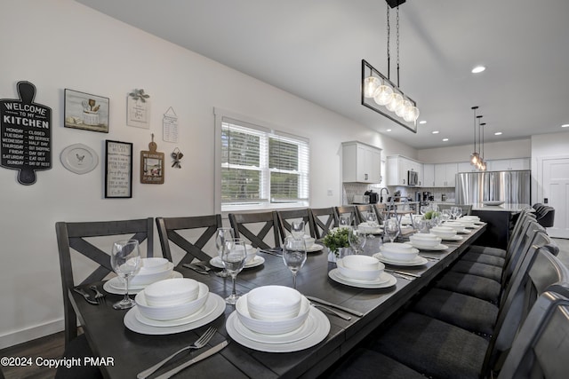 dining room with baseboards and recessed lighting