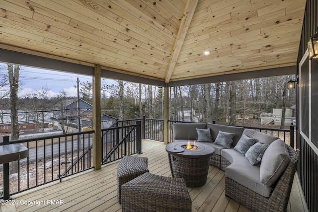 sunroom featuring lofted ceiling and wood ceiling