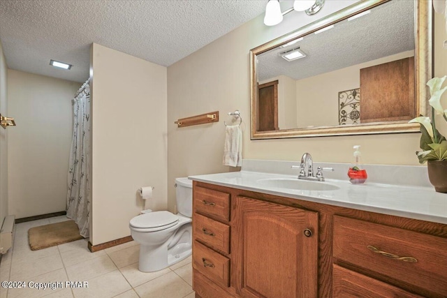 full bath featuring toilet, a shower with curtain, tile patterned flooring, a textured ceiling, and vanity