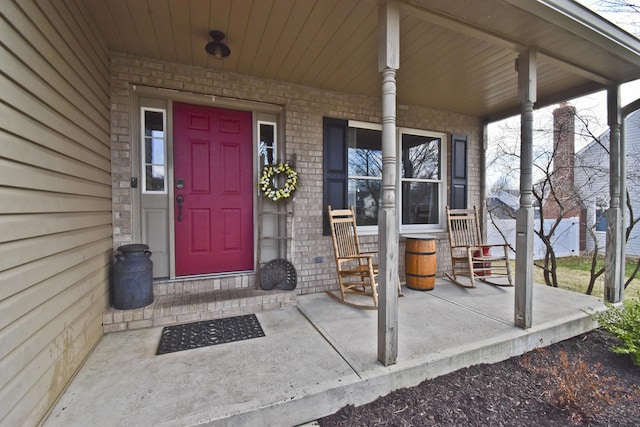doorway to property featuring covered porch