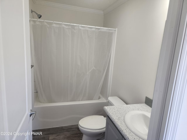 bathroom featuring crown molding, toilet, wood finished floors, vanity, and shower / bathtub combination with curtain