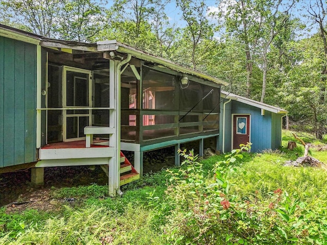 250 Sunrise Loop, Henryville, PA 18332 - view of home's exterior with a sunroom