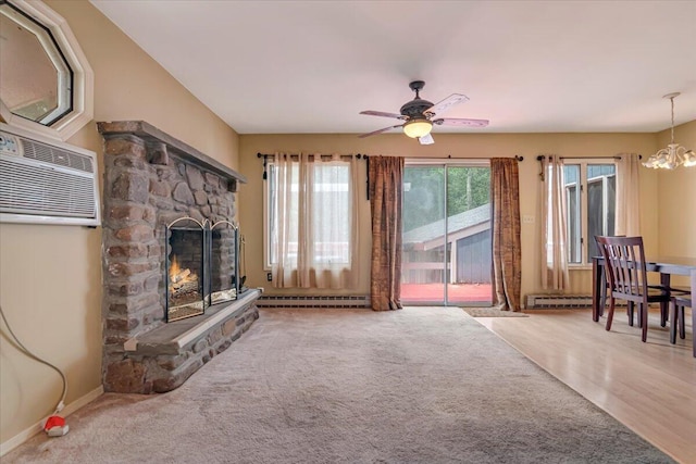 250 Sunrise Loop, Henryville, PA 18332 - unfurnished living room featuring a baseboard heating unit, a chandelier, a fireplace, a ceiling fan, and carpet flooring