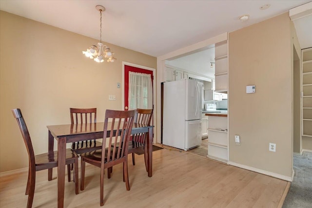 250 Sunrise Loop, Henryville, PA 18332 - dining area with a chandelier and light wood-type flooring