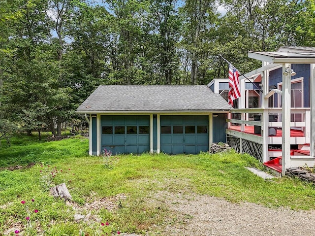250 Sunrise Loop, Henryville, PA 18332 - detached garage featuring view of wooded area