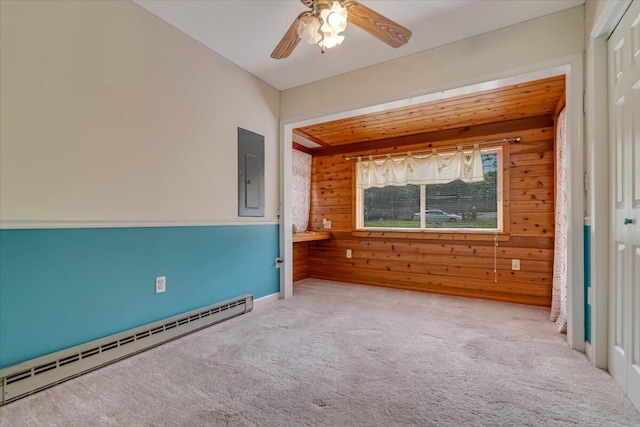 250 Sunrise Loop, Henryville, PA 18332 - unfurnished room featuring a baseboard radiator, electric panel, wood walls, carpet, and a ceiling fan