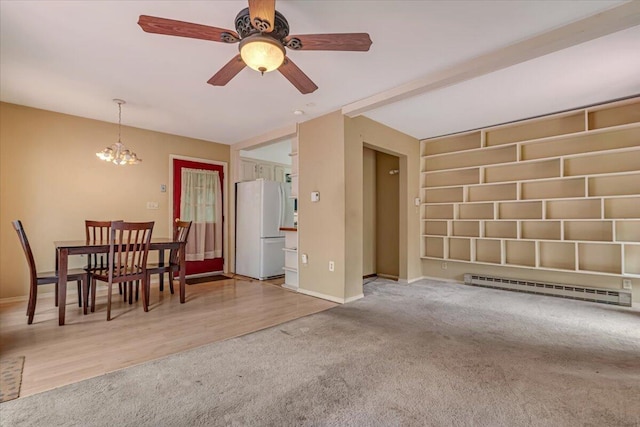 250 Sunrise Loop, Henryville, PA 18332 - dining room with baseboard heating, carpet flooring, a chandelier, and ceiling fan