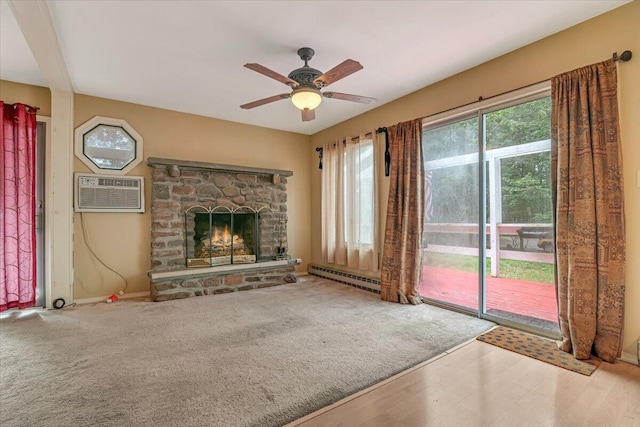 250 Sunrise Loop, Henryville, PA 18332 - unfurnished living room with a baseboard radiator, an AC wall unit, a stone fireplace, and ceiling fan