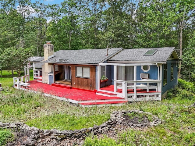 250 Sunrise Loop, Henryville, PA 18332 - rear view of house with a chimney, roof with shingles, a wooden deck, and cooling unit