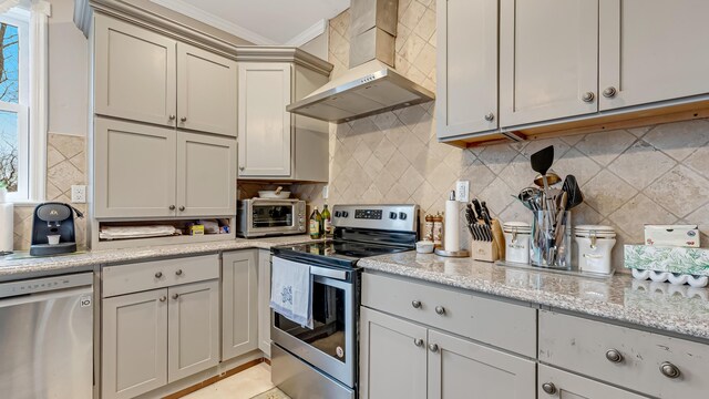 141 Old River Rd, Thornhurst, PA 18424 - kitchen with wall chimney range hood, a toaster, light stone countertops, decorative backsplash, and appliances with stainless steel finishes