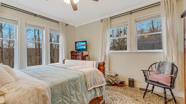 141 Old River Rd, Thornhurst, PA 18424 - bedroom featuring baseboards, multiple windows, ornamental molding, and wood finished floors