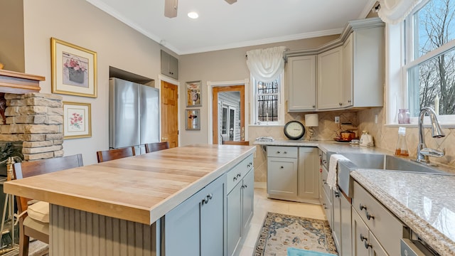 141 Old River Rd, Thornhurst, PA 18424 - kitchen featuring freestanding refrigerator, a kitchen breakfast bar, tasteful backsplash, butcher block counters, and ornamental molding