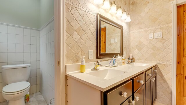 141 Old River Rd, Thornhurst, PA 18424 - bathroom with toilet, double vanity, a sink, and tile walls