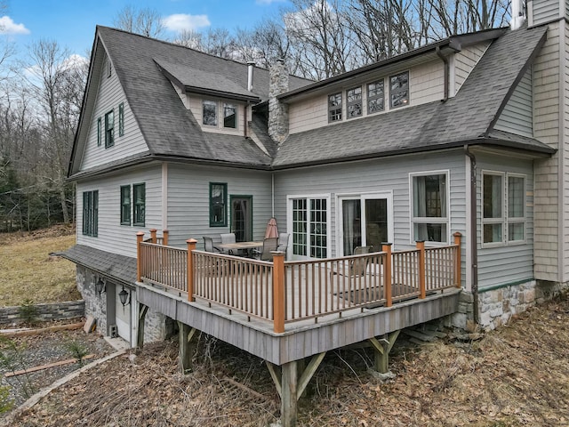 141 Old River Rd, Thornhurst, PA 18424 - back of property featuring a garage, roof with shingles, a deck, and a chimney