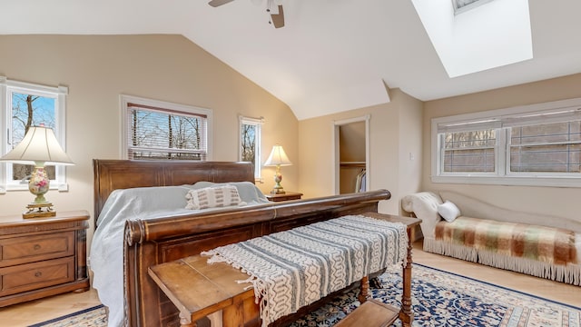 141 Old River Rd, Thornhurst, PA 18424 - bedroom featuring ceiling fan, lofted ceiling with skylight, and light wood-style floors
