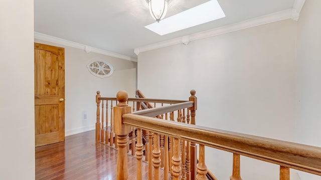 141 Old River Rd, Thornhurst, PA 18424 - hallway with baseboards, an upstairs landing, crown molding, a skylight, and wood finished floors