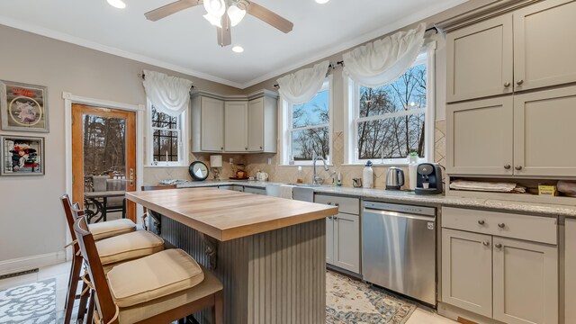 141 Old River Rd, Thornhurst, PA 18424 - kitchen with stainless steel dishwasher, ceiling fan, butcher block countertops, a breakfast bar area, and backsplash