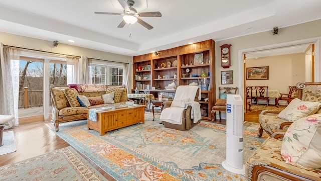 141 Old River Rd, Thornhurst, PA 18424 - living room with light wood finished floors, a ceiling fan, and a raised ceiling