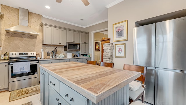 141 Old River Rd, Thornhurst, PA 18424 - kitchen with stainless steel appliances, tasteful backsplash, wall chimney exhaust hood, and ornamental molding