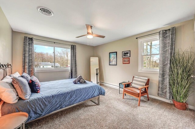 134 Altemose Rd, Pocono Lake, PA 18347 - carpeted bedroom featuring baseboards, multiple windows, ceiling fan, and visible vents