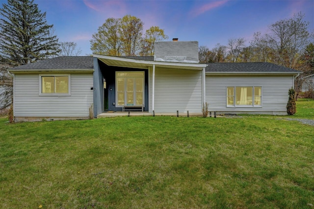 134 Altemose Rd, Pocono Lake, PA 18347 - rear view of house featuring a yard, a chimney, and roof with shingles