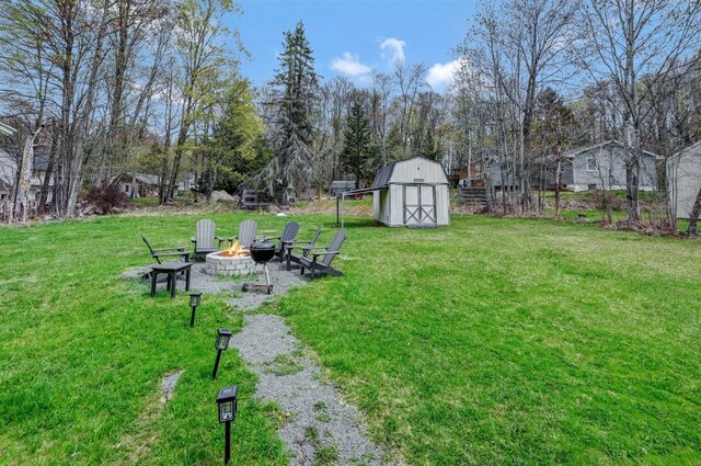 134 Altemose Rd, Pocono Lake, PA 18347 - view of yard featuring an outbuilding, an outdoor fire pit, and a storage shed