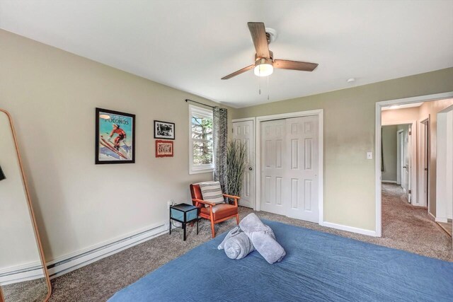 134 Altemose Rd, Pocono Lake, PA 18347 - bedroom featuring ceiling fan, baseboard heating, multiple closets, carpet, and baseboards