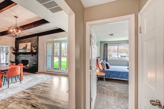 134 Altemose Rd, Pocono Lake, PA 18347 - corridor with a notable chandelier, beamed ceiling, visible vents, and wood finished floors