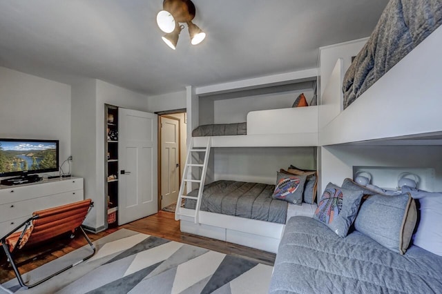 bedroom featuring wood finished floors