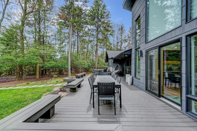deck with outdoor dining space
