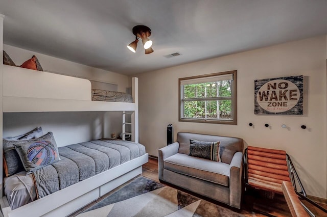 bedroom with visible vents and wood finished floors