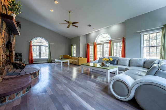 living room with high vaulted ceiling, a ceiling fan, recessed lighting, wood finished floors, and visible vents
