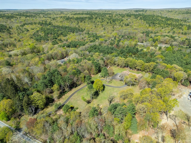 birds eye view of property with a forest view