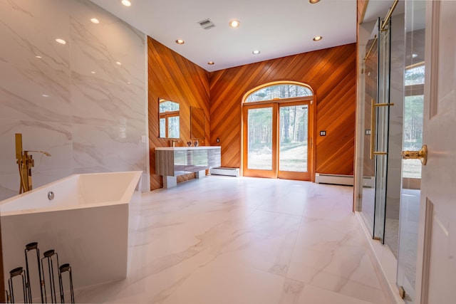 full bathroom with a baseboard heating unit, recessed lighting, and marble finish floor