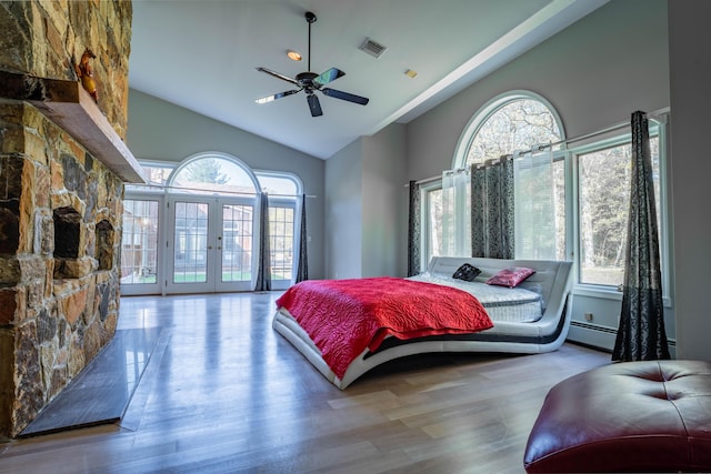 bedroom with french doors, access to exterior, visible vents, wood finished floors, and a baseboard radiator