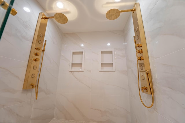 bathroom with a marble finish shower