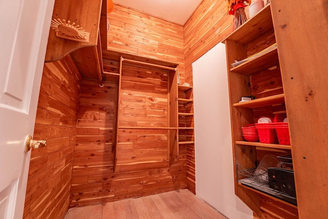 spacious closet with wood finished floors