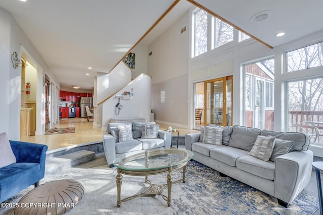 123 Shannon Ct, Bushkill, PA 18324 - living area with healthy amount of natural light, wood finished floors, french doors, a high ceiling, and recessed lighting