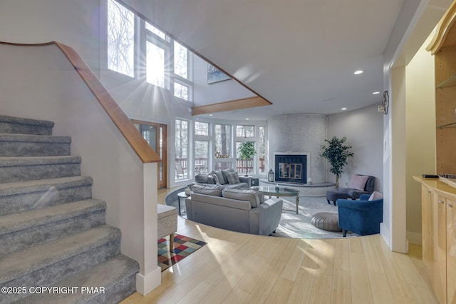 123 Shannon Ct, Bushkill, PA 18324 - living area featuring recessed lighting, wood finished floors, stairs, and a fireplace