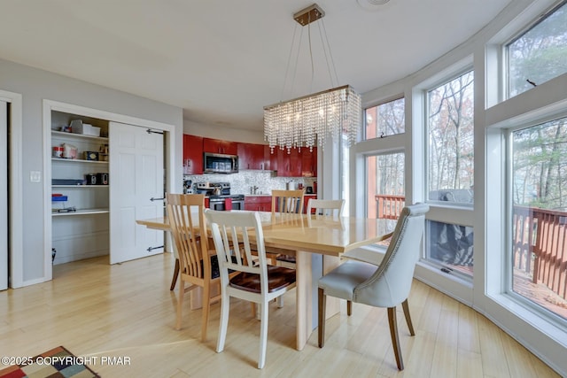 123 Shannon Ct, Bushkill, PA 18324 - dining room with a chandelier and light wood finished floors