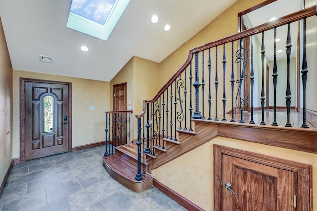 374 Packer Dr, Weatherly, PA 18255 - entryway with vaulted ceiling with skylight, baseboards, visible vents, and stairs
