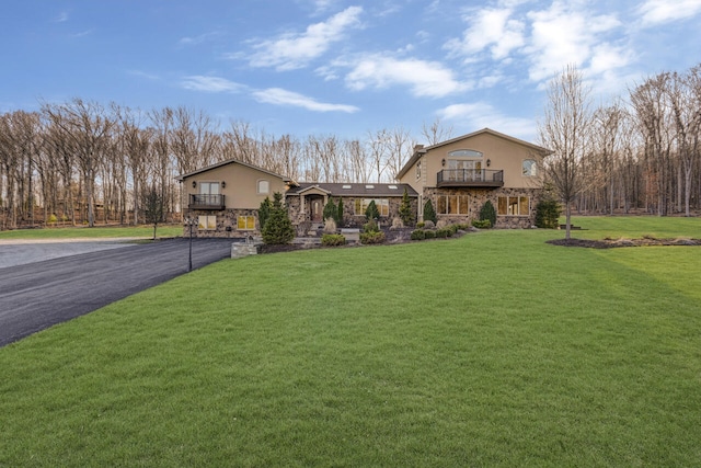 374 Packer Dr, Weatherly, PA 18255 - view of front of home with a balcony, stucco siding, and stone siding