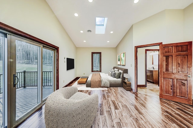 374 Packer Dr, Weatherly, PA 18255 - bedroom featuring baseboards, high vaulted ceiling, light wood-style floors, a skylight, and access to outside