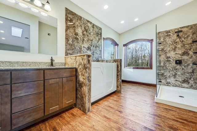 374 Packer Dr, Weatherly, PA 18255 - full bathroom featuring vanity, vaulted ceiling, recessed lighting, wood finished floors, and walk in shower