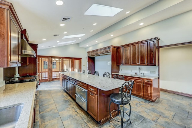 374 Packer Dr, Weatherly, PA 18255 - kitchen featuring wall chimney range hood, recessed lighting, visible vents, and a sink