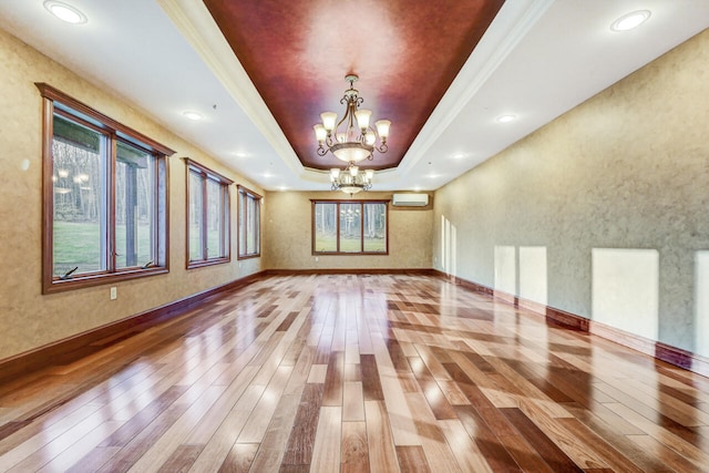 374 Packer Dr, Weatherly, PA 18255 - unfurnished room featuring an inviting chandelier, a tray ceiling, baseboards, and hardwood / wood-style floors