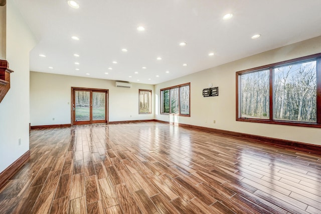 374 Packer Dr, Weatherly, PA 18255 - unfurnished living room featuring wood finished floors, recessed lighting, baseboards, and a wealth of natural light