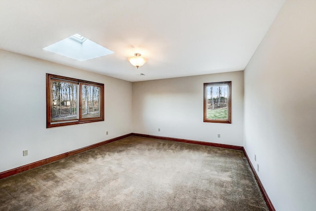 374 Packer Dr, Weatherly, PA 18255 - empty room featuring a skylight, baseboards, and carpet