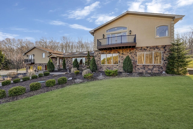 374 Packer Dr, Weatherly, PA 18255 - back of house with a yard, stucco siding, stone siding, and a balcony